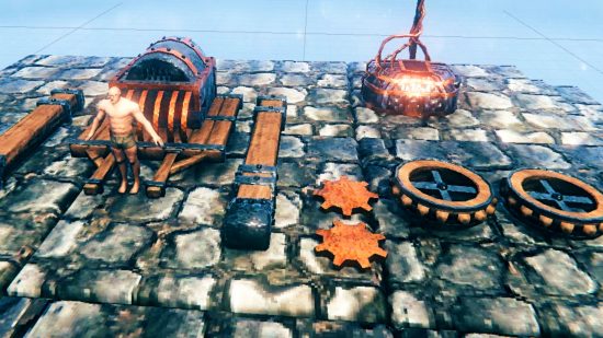 Valheim vehicle tease - an image shared by developer Robin 'Grimmcore' Eyre featuring a reinforced cart, two lumber beams, two cogs, two wheels, and an Obliterator furnace