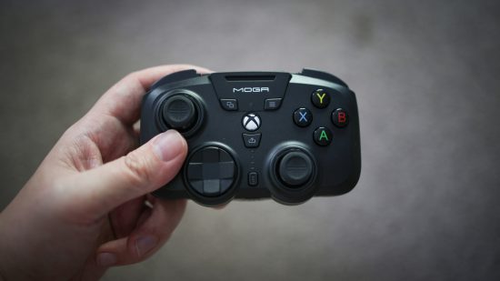 The Moga XP Ultra PC controller being held in the hand