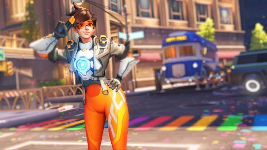 Overwatch 2 hero Tracer posing on a street painted rainbow for Pride