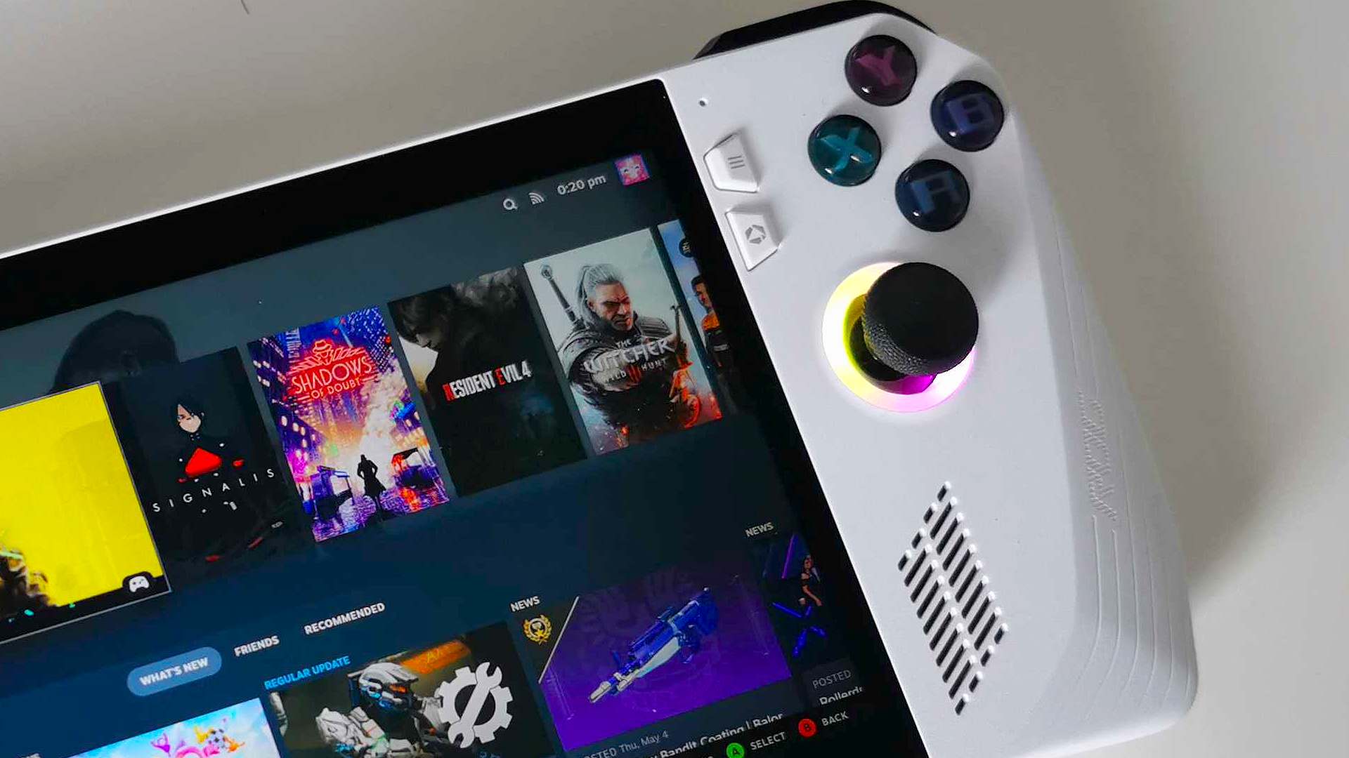 Closeup of Asus ROG Ally handheld PC on white surface