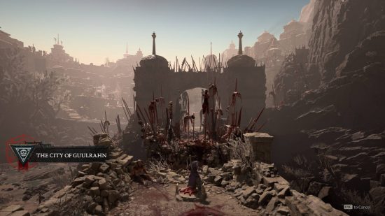 The remains of a desert city with hundreds of corpses impaled on spikes outside it