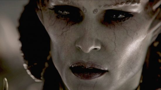 Diablo 4 runes and runewords: A close up on the face of Lilith, her skin grey and eyes black.