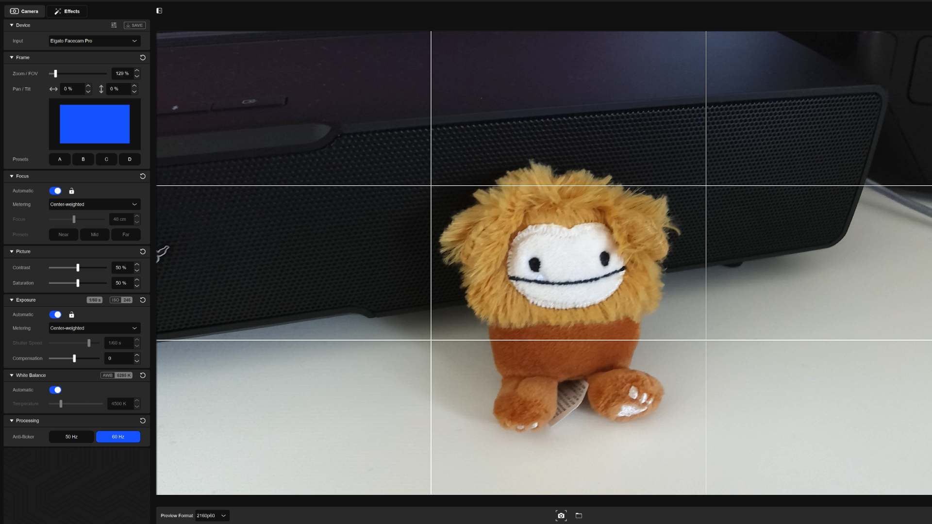 Elgato Facecam Pro footage of bigfoot toy on white desk via Camera Hub app