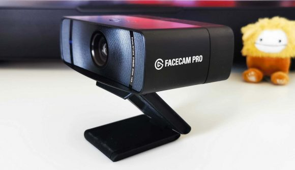 Elgato Facecam Pro with logo and text on side sitting on white desk
