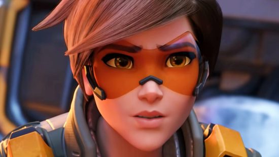Overwatch 2 PvE cancelled - Tracer, a young girl in orange protective glasses, makes a concerned face