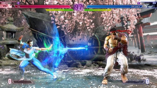 Street Fighter 6 Chun-Li is firing a Kikoken at Ryu.