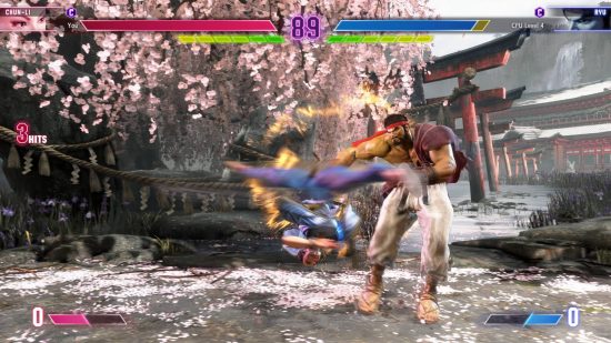 Street Fighter 6 Chun-Li is using her iconic Spinning Bird Kick to hit Ryu in the stomach.