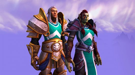 A human Alliance member and an orc Horde member stand closely together, wearing matching tabards that denotes them as being part of a cross-faction guild, one of the major features introduced for the WoW Dragonflight 10.1 Embers of Neltharion release date.
