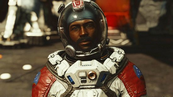 A man from Starfield stands staring into the camera, his spacesuit and glass helmet on