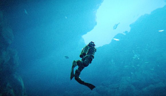 A lone diver underwater in an empty blue sea in Under the Waves