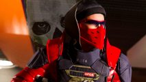 Call of Duty Modern Warfare 2 anticheat hallucinations - a person wearing red and black armor walks down a corridor as the translucent skull-masked face of 'Ghost' appears behind them.