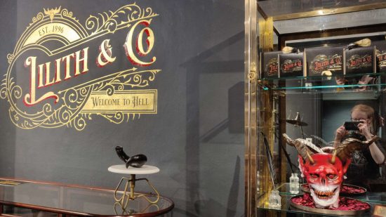 Diablo 4 chocolate shop - a display cabinet with a demonic red skull and several 'Lilith & Co' chocolate bars.