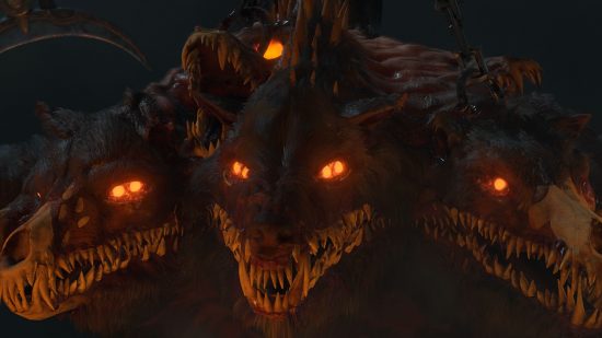 A multi-headed demon dog in Diablo 4, its eyes burning in the darkness, and its flesh decaying from around its muzzle, and just one of many fearsome foes that can spell an end to your character in Diablo 4 Hardcore mode.
