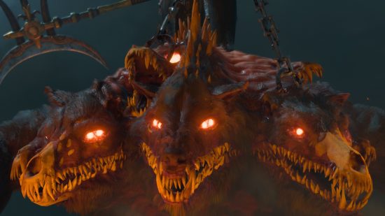 Diablo 4 stash: a three-headed dog beast snarls menacingly with yellow teeth and glowing red eyes.