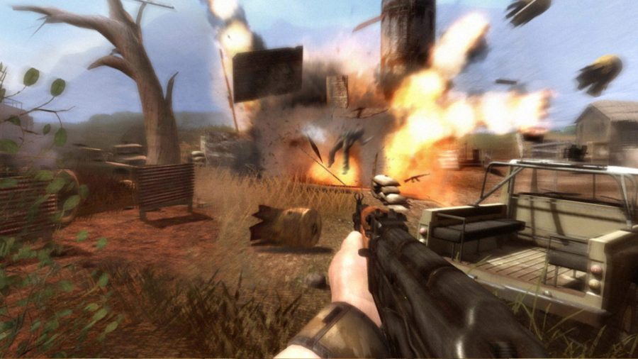 Far Cry 2 - an explosion sends various debris flying across an arid plain.
