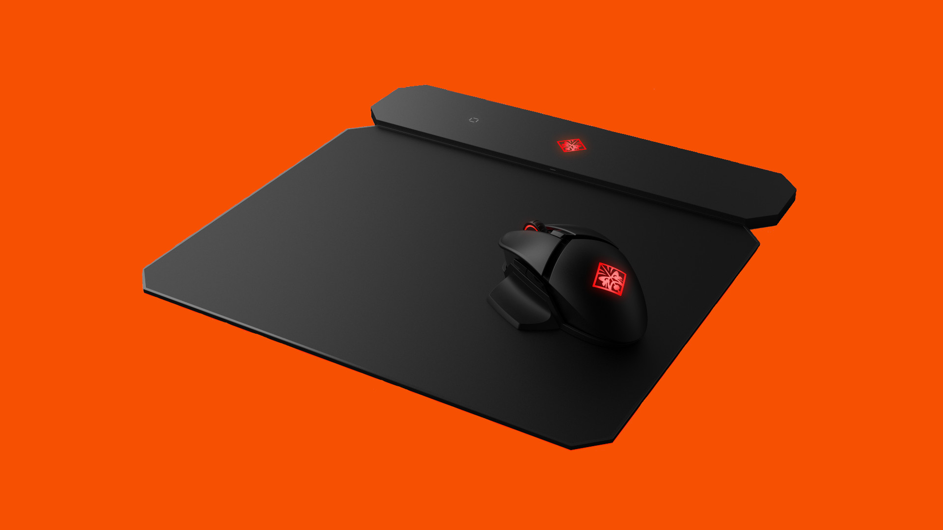 hard or soft mouse pad: An OMEN Photon mousepad with Qi Charging sits on an orange background