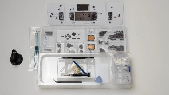 Steam Deck mod transforms the PC into a Game Boy Color: Parts included in the transparent case mod for the Steam Deck laid out on a flat surface.