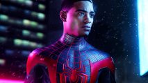 Marvel's Spider-Man Steam sale - Miles Morales stands in the snowy night, wearing his black and red spider-suit.