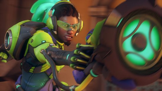 Overwatch 2 characters: a man wearing a green tactical suit holds up a gun that fires sound waves.