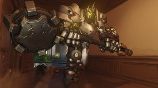 Overwatch 2 characters: a very large man in silver armor wielding a huge hammer.