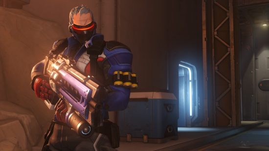Overwatch 2 characters: a grey haired soldier wearing a red visor, holding a machine gun.