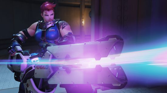 Overwatch 2 characters: a muscular woman with pink hair holds a gigantic energy weapon.