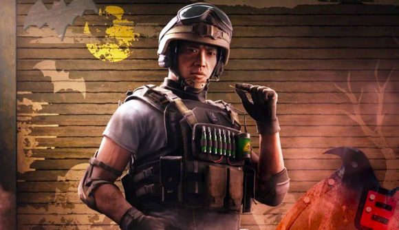 Rainbow Six Siege Steam sale: A Hong Kongese man wearing a tactical helmet and vest stands in front of a brick wall holding one hand to his face