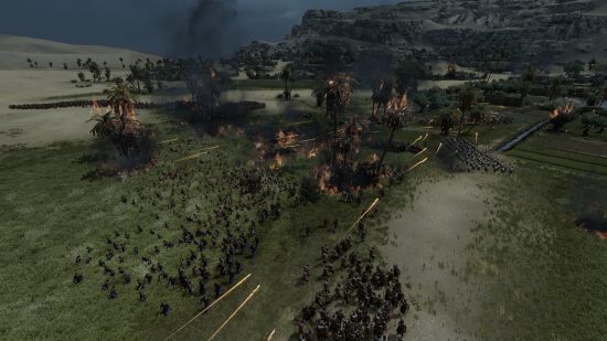 Overhead view of a bloody battle being fought at dusk.