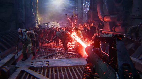Warhammer 40k Darktide - a horde approaches the player, as they blast at the crowd with a lasgun.