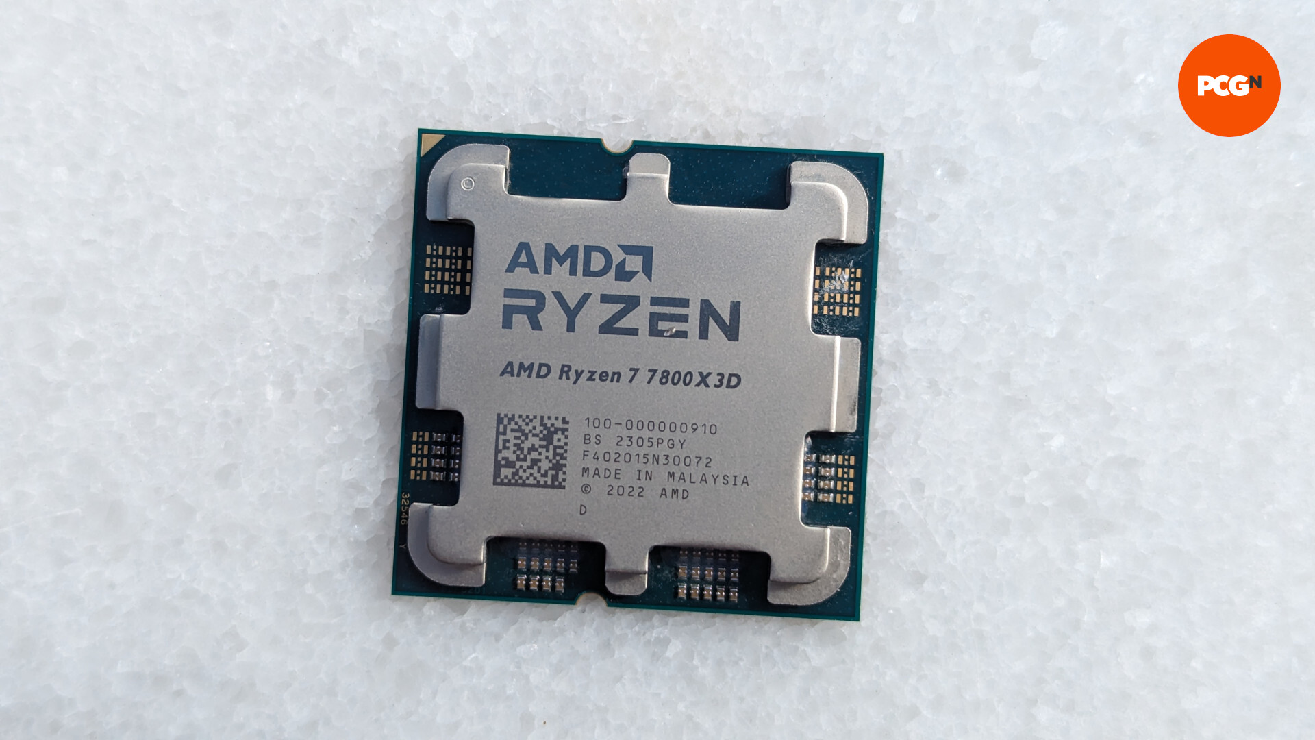 AMD Ryzen 7 7800X3D review: CPU rests on a white surface