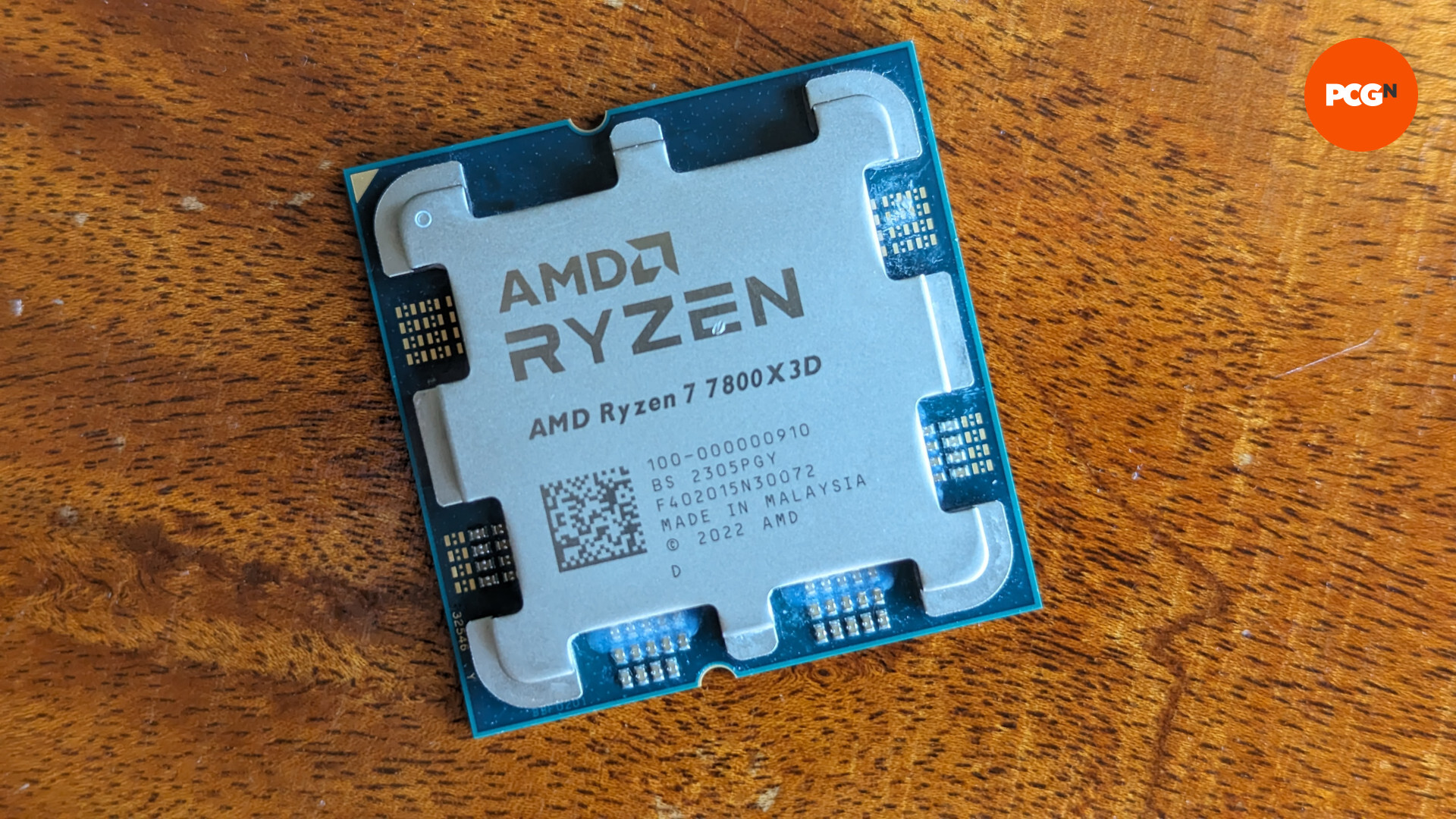 AMD Ryzen 7 7800X3D review: The CPU rests on a wooden surface