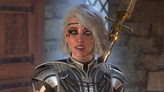 An elf with silver armor and white hair, staring at a person offscreen. It's unclear if the sword strapped to her back is one of the best Baldur's Gate 3 weapons.