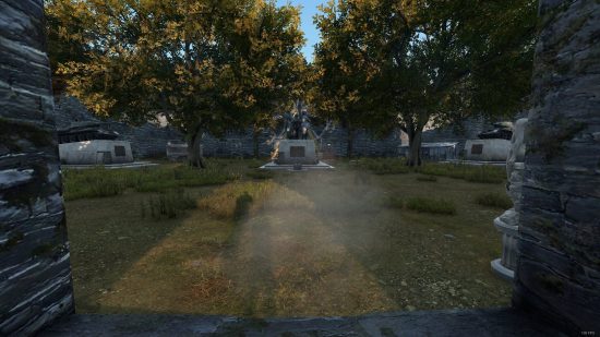 best dayz servers: a memorial site covered in trees as the sun goes down