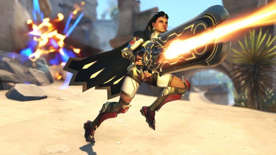 Beste gratis stoomspellen: een held van Overwatch 2 vuurt een laser uit haar pistool in de woestijn