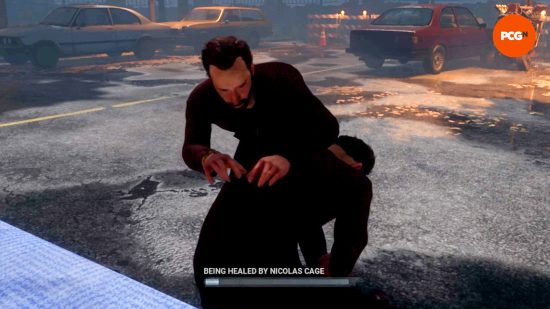 A player, as Nicolas Cage, is being "healed by Nicolas Cage" in Dead by Daylight.