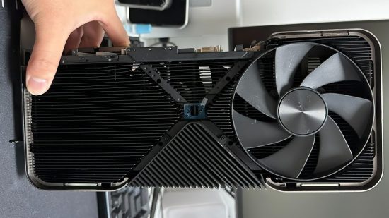 A hand (top left) holding an alleged Nvidia GeForce RTX 4090 Ti cooler