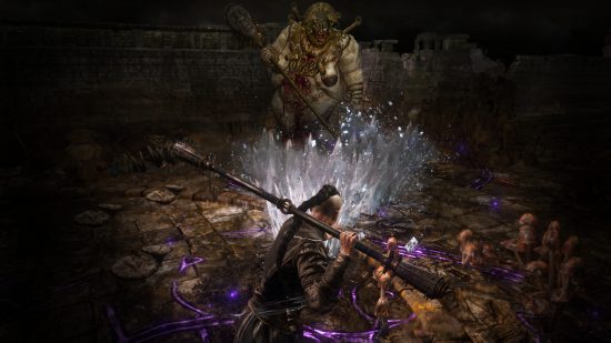 Path of Exile 2 - a monk holding a staff fires a blast of ice towards a giant monster.