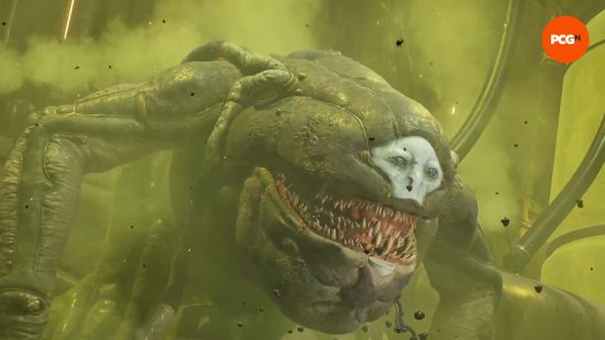 Remnant 2 review: Tal'Ratha, a biomechanical boss with a humanoid face surrounded by rows of shark-like teeth, grins in delight, cloaked in green gas.