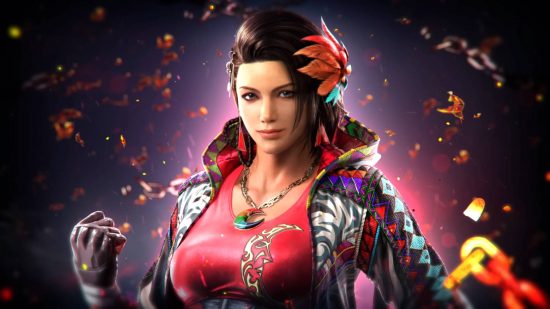 Azucena is a new character in the Tekken 8 roster. She is wearing a colorful jacket over a red t-shirt with a crescent moon design. She has a crescent moon pendant and a flower in her brown hair.