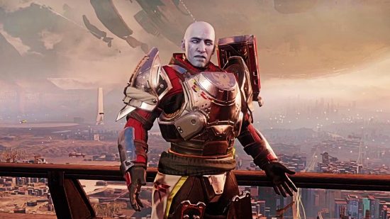 Destiny 2's Zavala stands in a suit of red and gold-silver armor with his arms out
