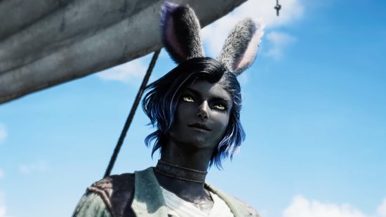 A grey-skinned bunny boy with long ears smiles to his side, standing atop a sailing ship