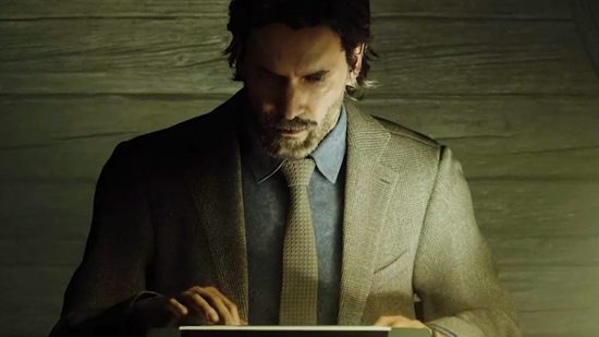 Alan Wake 2 delay - A man in a suit sits at a desk, typing.