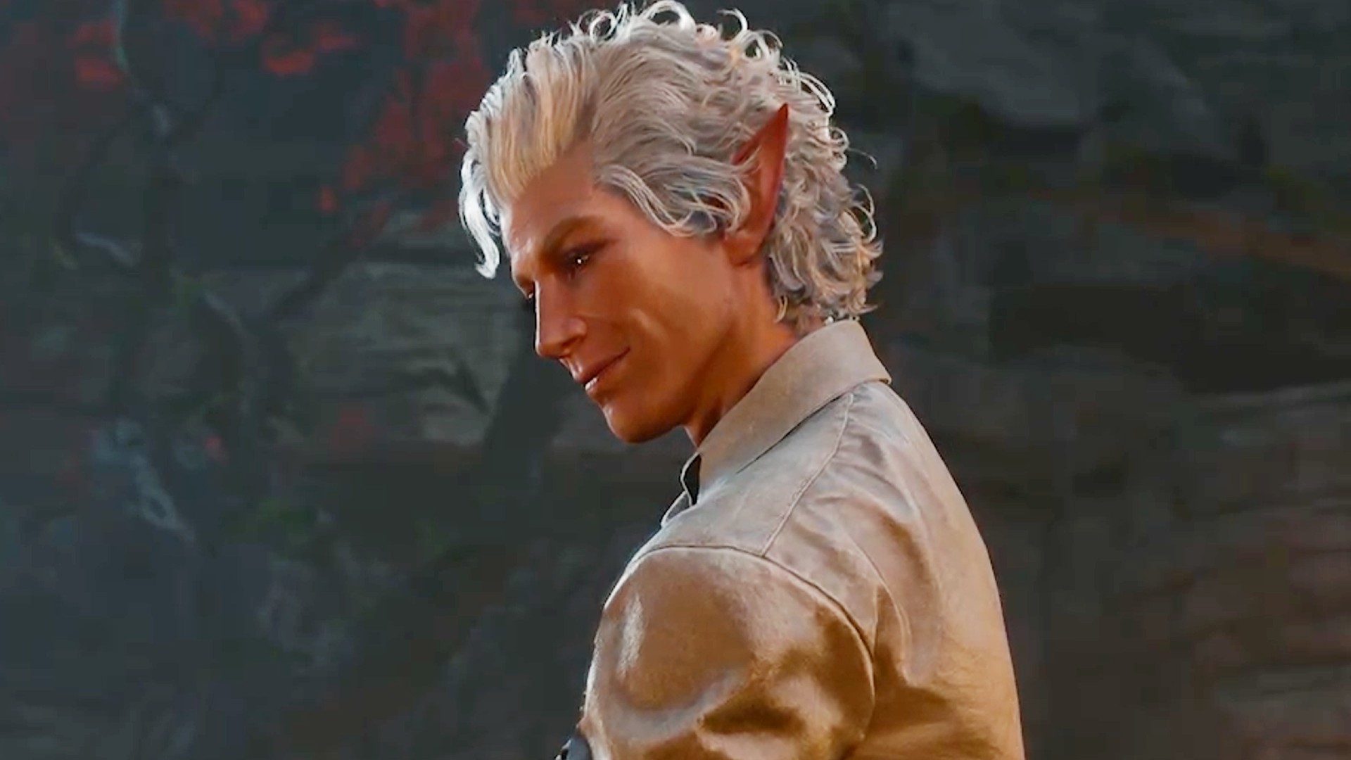 Silver-haired vampire Astarion looks down with a small smile on his face.
