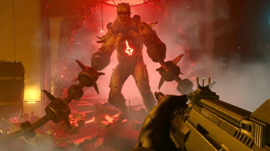 Killing Floor 3 details: A large Fleshpound leaves a hole in the wall behind him, as long spiked arm attachments trail on the floor and the player points a gun towards it.