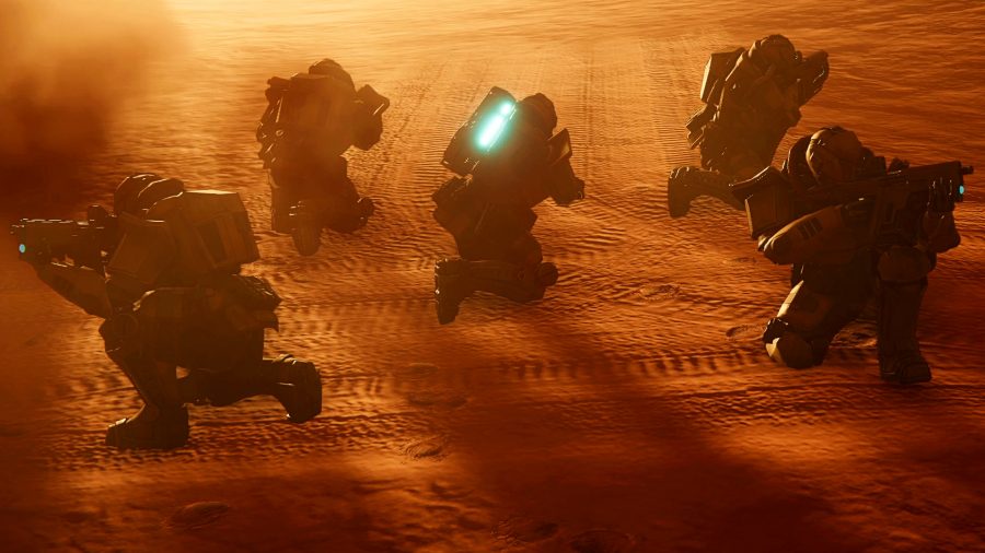 Several men in space uniforms crouching in a desert area with glowing backpacks, guns at the ready