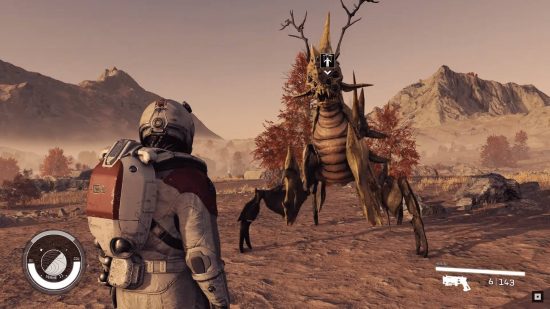 A man in a space suit looks up at a four-legged alien creature with antlers and leaves on its back in a barren setting