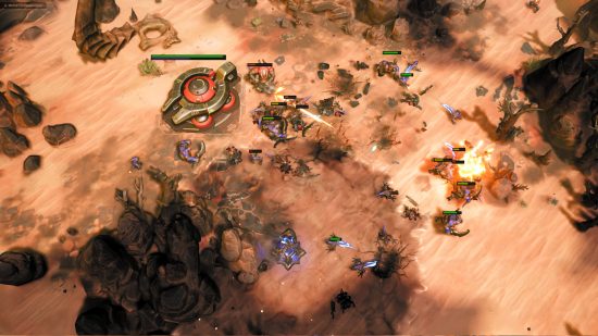 Stormgate gameplay - Human Resistance and Infernal Host forces clash on a sandy, rocky, arid map.