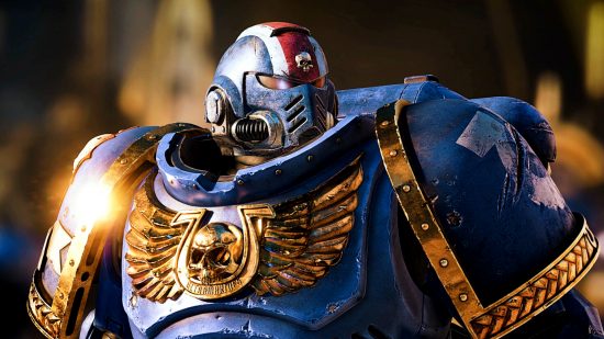 Warhammer 40k Space Marine 2 - a Space Marine in blue and golden armor.