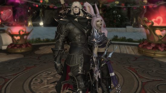 A tall man with scales on his face and horns wearing black armor stands with a girl with pink hair and bunny ears with her back to him