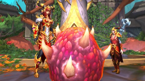 Two draconic women in armor with golden trims stand looking at a huge red egg with spikes